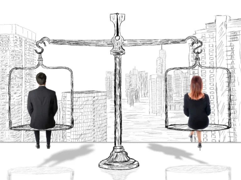 man and woman sit on either side of a cartoon human-sized manual scale