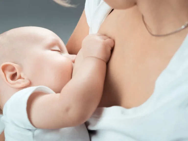 woman breastfeeding baby