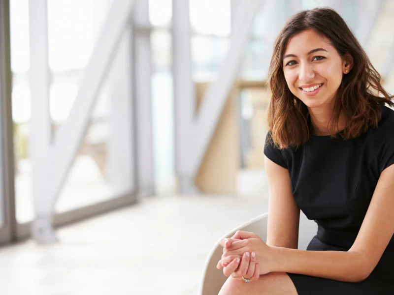 professional woman smiling while sitting