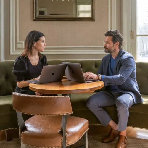 Attorneys Scott M. Peterson and Giovanna A. D'Orazio meeting at a table