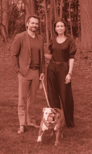 Scott and Giovanna outside with their pet bulldog